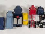 a lot of toy trucks that are lined up on the table