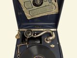 an old record player sitting in a blue case