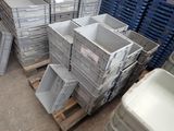 a pile of crates sitting on a pallet in a warehouse