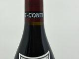 a bottle of wine that is sitting on a table