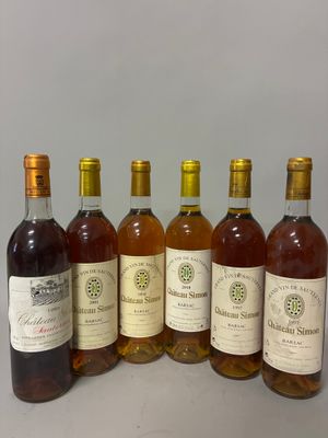 six bouteilles de vin sont alignées sur une table