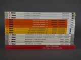several books stacked on top of each other on a table