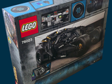 lego batman batmobile set in a box on a blue background