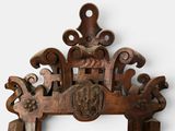 a picture of a wooden frame with carvings on it