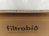 a brown box with a black logo on it sitting on a white surface