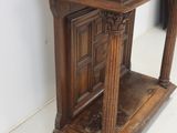 a wooden table with a clock on top of it