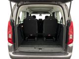 two seats in the back of a van with the doors open