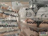 many bags of food wrapped in plastic on a table