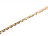 a close up of a gold chain on a white background