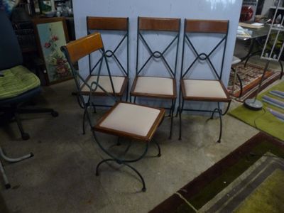 four chairs are sitting next to each other in a room