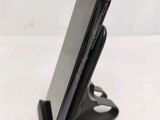 a cell phone that is sitting on top of a stand