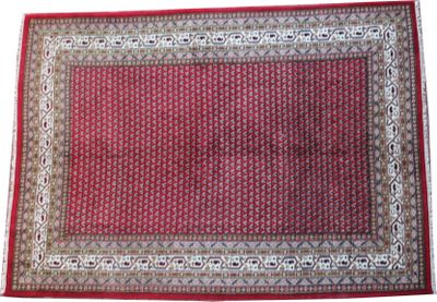 gros plan d'un tapis rouge sur fond blanc