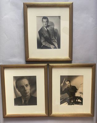 three framed photographs of a man in a suit and a woman in a dress