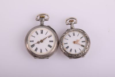 pair of antique silver pocket watches with roman numerals and roman numerals