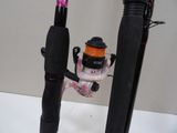 a fishing rod and a reel on a table
