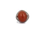 an oval coral and diamond ring
