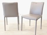 two chairs sitting next to each other on a hard wood floor