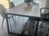 a desk with two computer monitors on it in a room