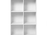 white bookshelf with six shelves on a white background
