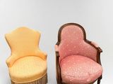two chairs and a stool in a room with a white background