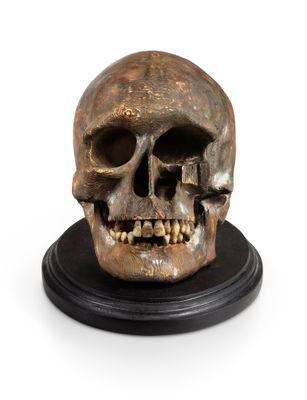 an image of a skull on a black base on a white background