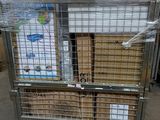 a metal cart with a bunch of boxes on top of it
