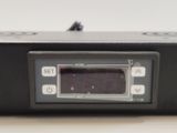 a close up of a digital clock on a table