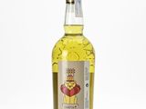 a bottle of whisky sitting on top of a white surface