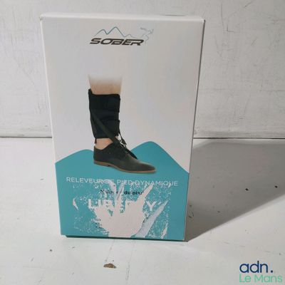 the box of the shoe is open on a white surface
