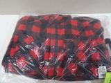 a red and black plaid shirt wrapped in plastic