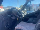 a picture of the inside of a van with the driver ' s seat down