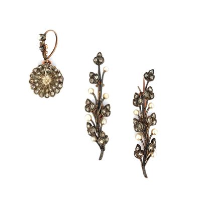 a close up of a pair of earrings on a white background
