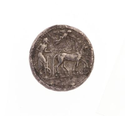 une image représentant une pièce d'argent sur laquelle figurent un homme et un cheval