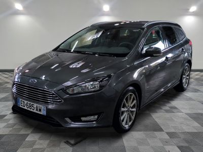 the grey ford focus is parked on a checkered floor