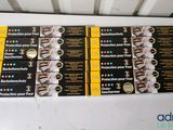 four packs of black and yellow adhesives on top of a white table