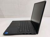 the laptop is sitting on a white surface with a black keyboard