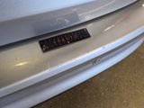 a close up of a car with a sticker on it ' s bumper