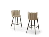 a pair of beige bar stools with black legs