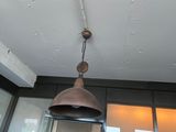 a light that is hanging from the ceiling in the room