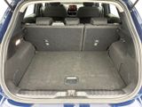 a trunk of a car with the back seats folded down