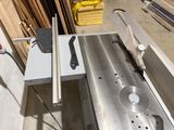 a picture of a table saw in a workshop