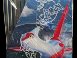 a box of pokemon trading cards with a plane on it