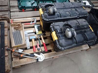 many tools that are sitting on a pallet on the floor