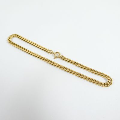 a gold chain with a clasp on a white background