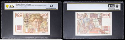 three different types of currency are on display in a display case