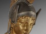 bronze statue of a roman soldier with a helmet on his head