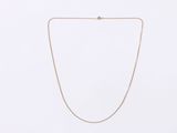 a gold chain necklace with a diamond clasp on a white background