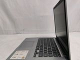 an open laptop computer sitting on top of a white table