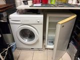 a washer and a dryer in a small kitchen