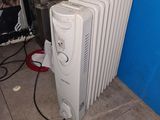 a white radiator sitting next to a blue wall